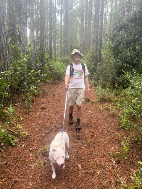 David and Lady walking on the Hammock Trail in the Cedar Point Preserve