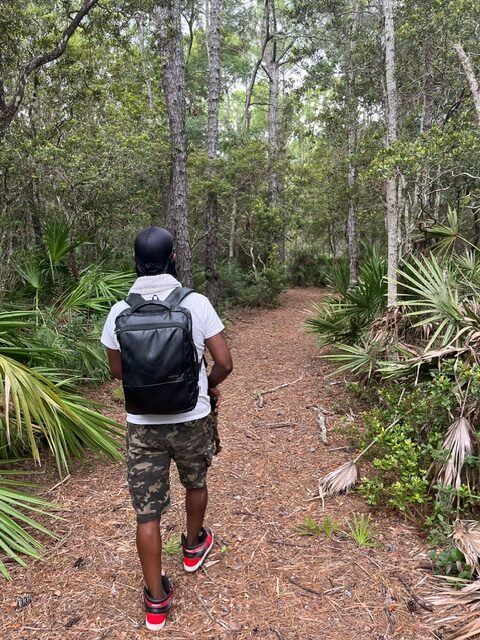 Mykeal walking on the Hammock Trail in the Cedar Point Preserve.