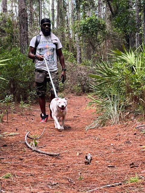 Mykeal and his dog Lady walking on the trail.