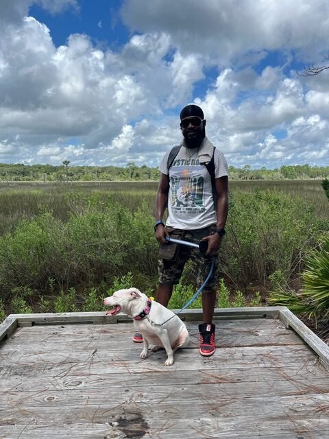 Mykeal and his dog Lady at the Overlook point off the trail in the Cedar Point Preserve.